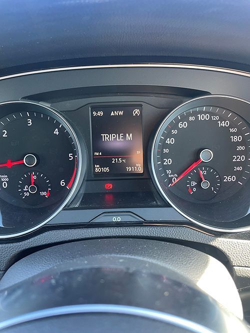 A Close Up of a Car Dashboard With a Screen That Says Triple M on It — Pelican Motors Service Centre In Caloundra West, QLD 