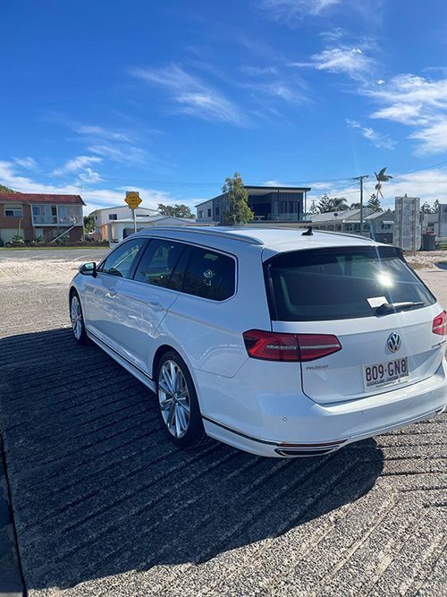 A White Volkswagen Passat Station Wagon is Parked in a Parking Lot — Pelican Motors Service Centre In Caloundra West, QLD 
