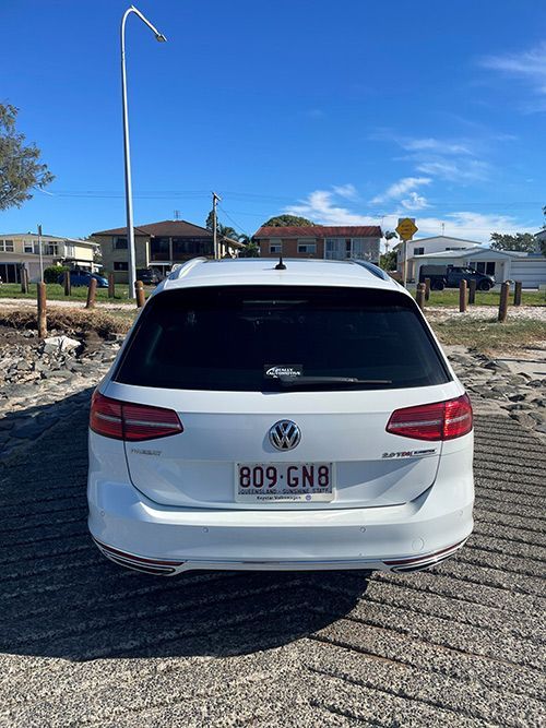 A White Volkswagen Station Wagon is Parked on the Side of the Road — Pelican Motors Service Centre In Caloundra West, QLD 