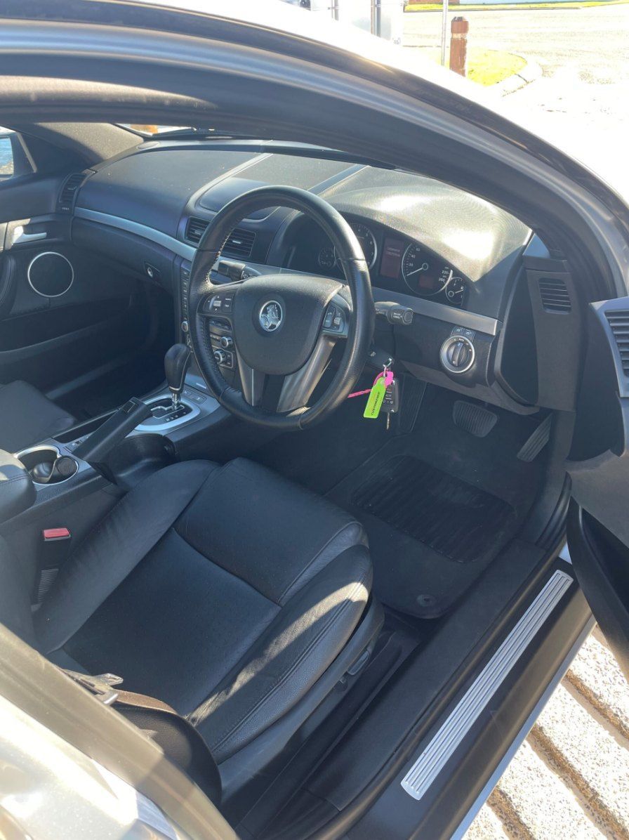 The Interior of a Car With the Door Open and the Steering Wheel Visible — Pelican Motors Service Centre In Caloundra West, QLD 
