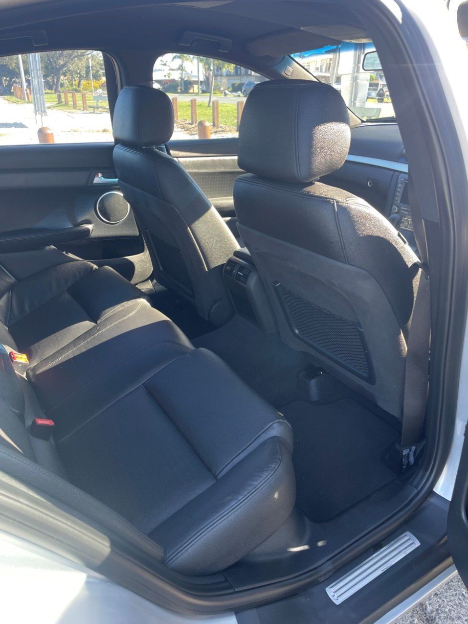 The Back Seat of a White Car With Black Leather Seats — Pelican Motors Service Centre In Caloundra West, QLD 