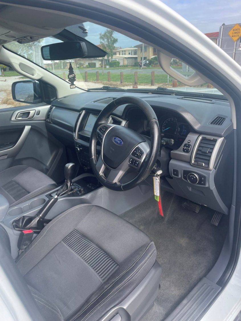 The Interior of a White Ford Ranger is Shown With the Door Open — Pelican Motors Service Centre In Caloundra West, QLD 