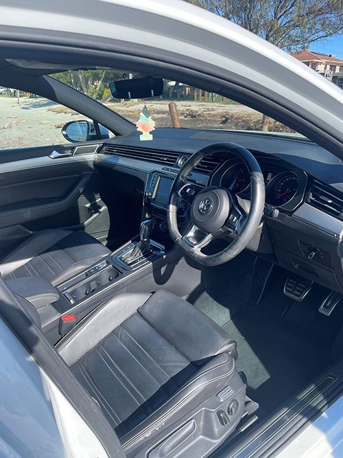 The Interior of a White Car With the Door Open and the Steering Wheel Visible — Pelican Motors Service Centre In Caloundra West, QLD 