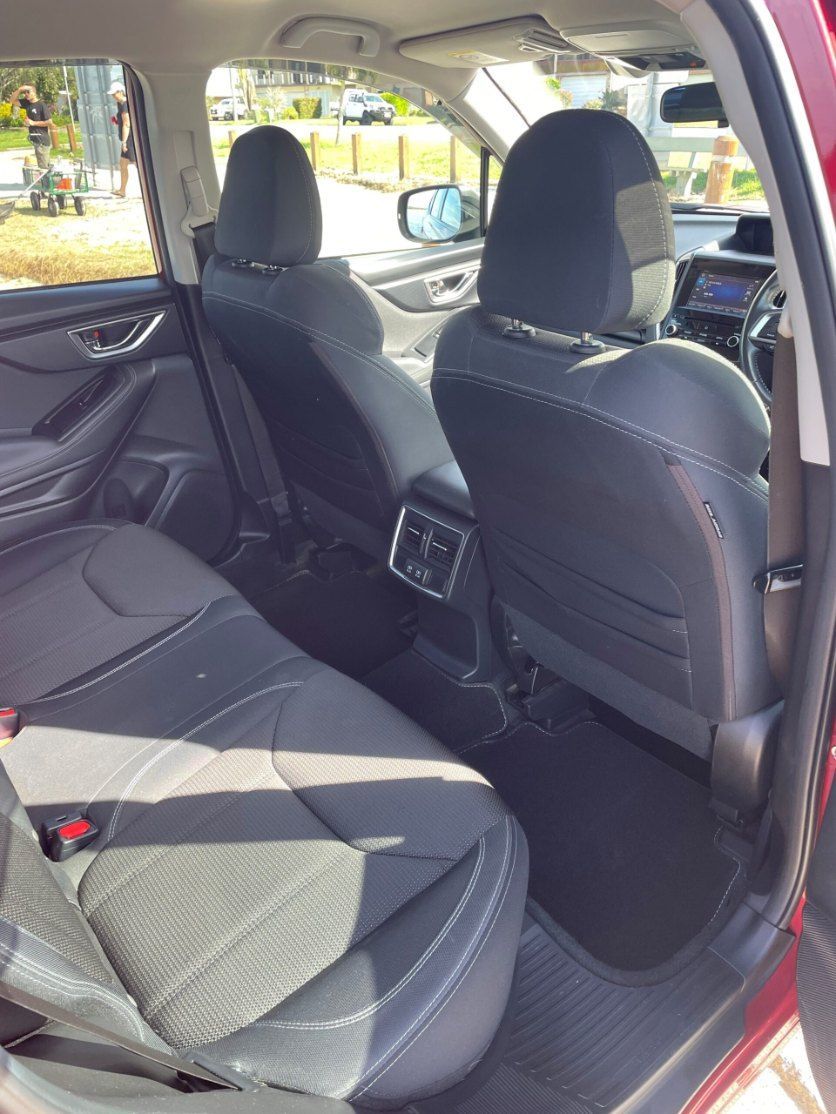 The Back Seat of a Red Car With Black Seats — Pelican Motors Service Centre In Caloundra West, QLD 