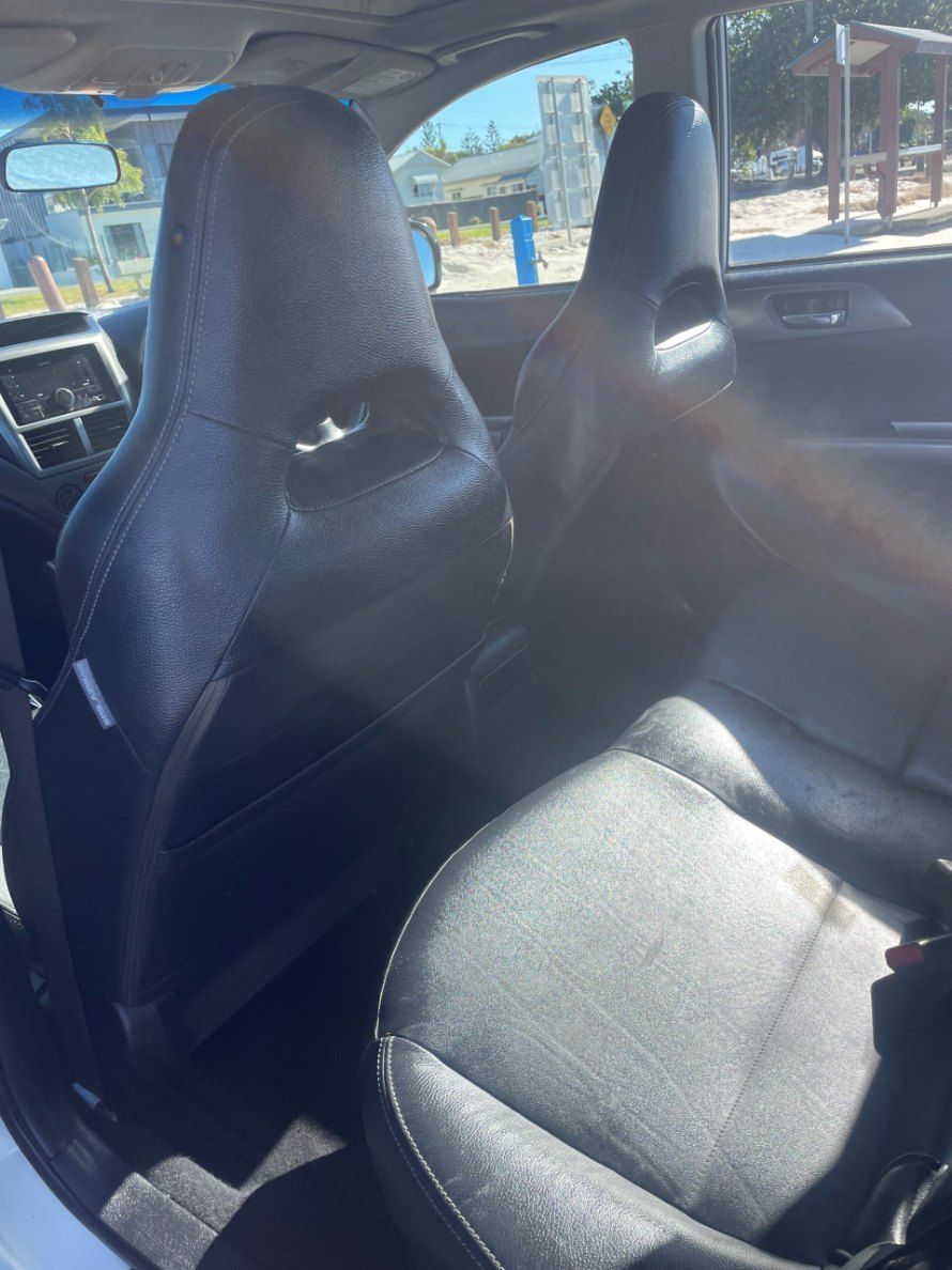 The Back Seat of a White Car With Black Seats — Pelican Motors Service Centre In Caloundra West, QLD 