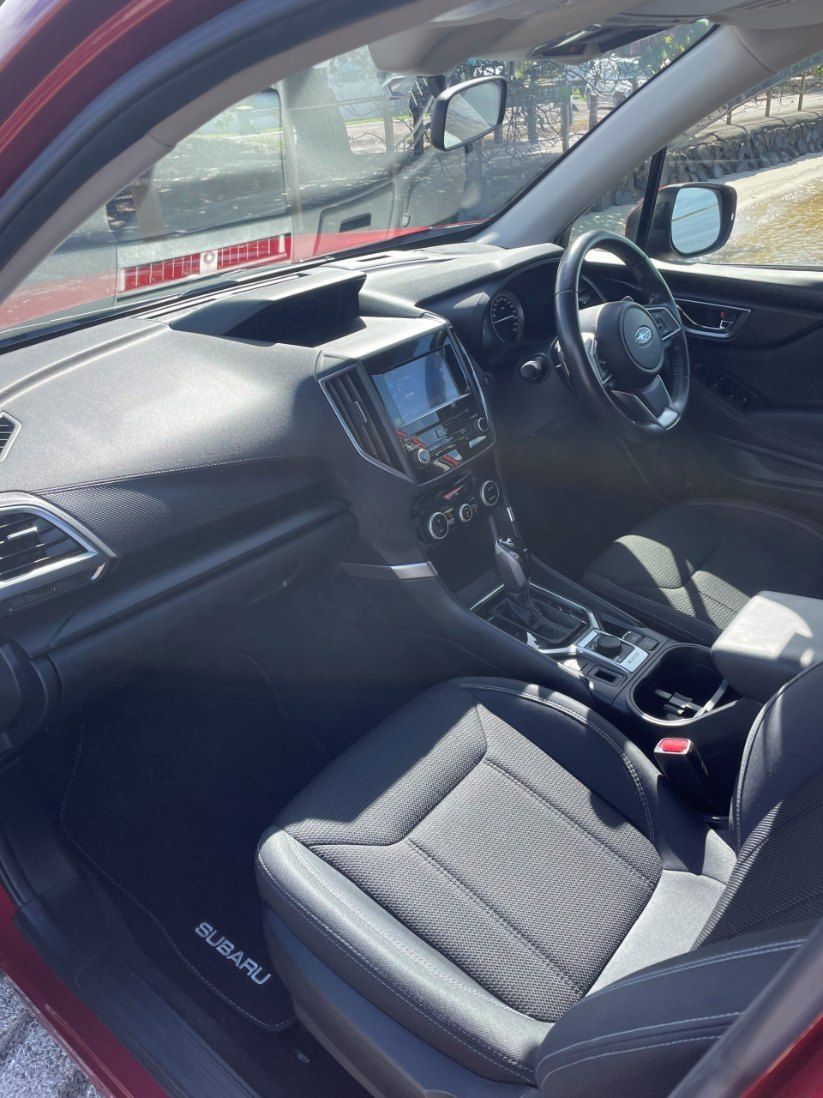 The Interior of a Red Subaru is Shown With the Door Open — Pelican Motors Service Centre In Caloundra West, QLD 