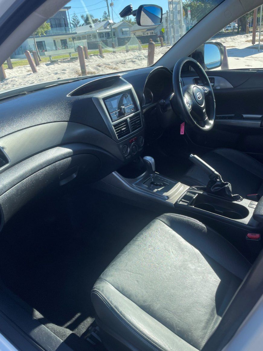 The Interior of a White Car With Black Seats — Pelican Motors Service Centre In Caloundra West, QLD 
