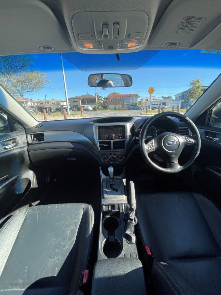 The Inside of a Car With a Steering Wheel and a Rear View Mirror — Pelican Motors Service Centre In Caloundra West, QLD 