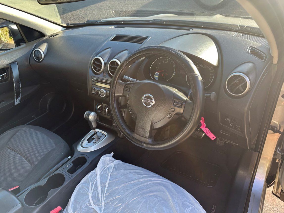 The Interior of a Car With a Steering Wheel and a Dashboard — Pelican Motors Service Centre In Caloundra West, QLD 