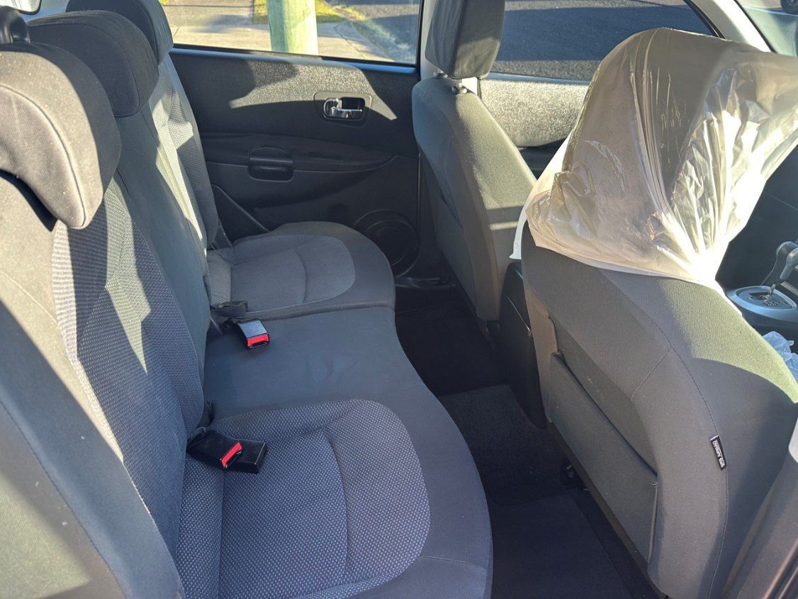 The Back Seat of a Car With a Seat Belt on It — Pelican Motors Service Centre In Caloundra West, QLD 