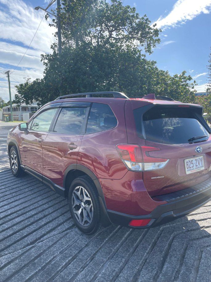 A Red Subaru Forester is Parked in a Parking Lot — Pelican Motors Service Centre In Caloundra West, QLD 