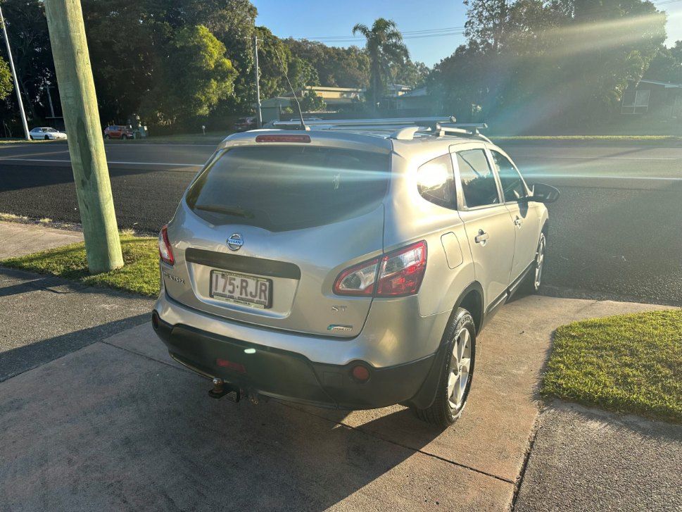 A Silver Nissan Qashqai is Parked on the Side of the Road — Pelican Motors Service Centre In Caloundra West, QLD 