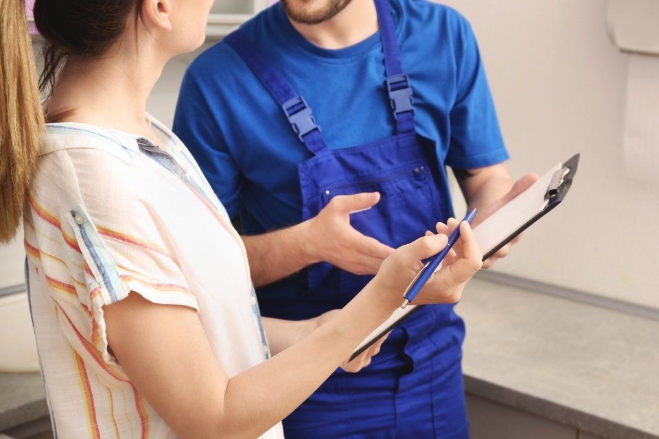 women consulting with plumber