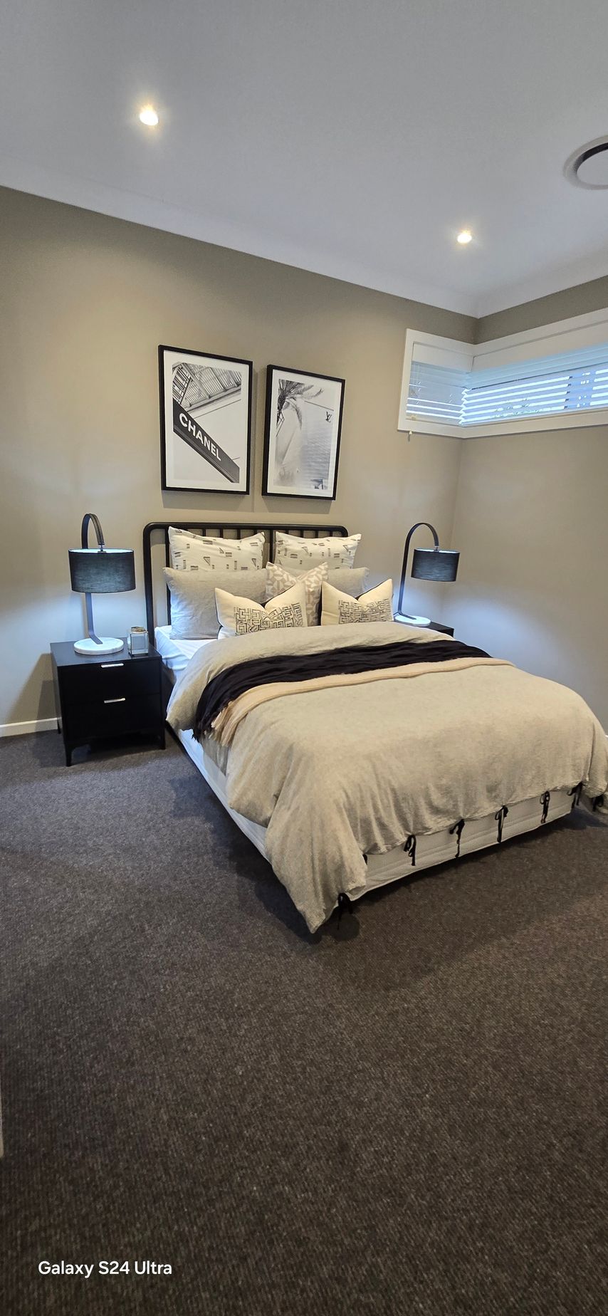 A light bedroom space with black bedside lamps and tables — A Place 2 Shine In Chisholm, NSW