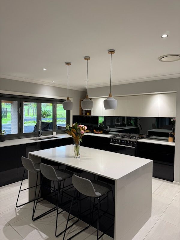 A Person Wearing Yellow Gloves is Cleaning a Counter With a Cloth — A Place 2 Shine In Chisholm, NSW