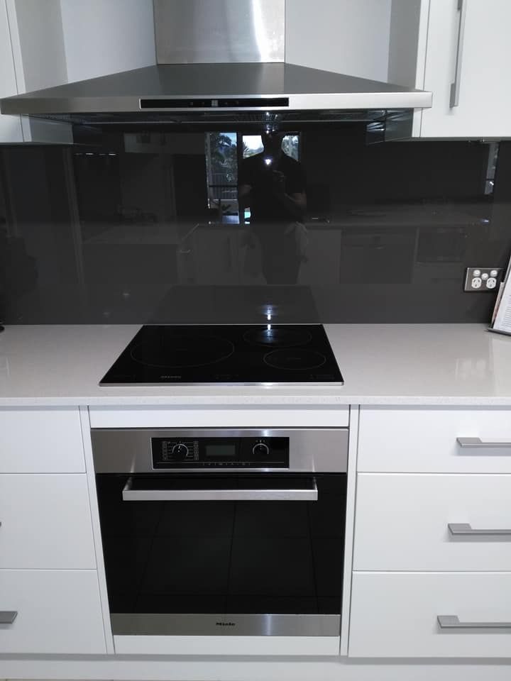 A Kitchen With a Stove Top Oven and a Hood — A Place 2 Shine In Chisholm, NSW