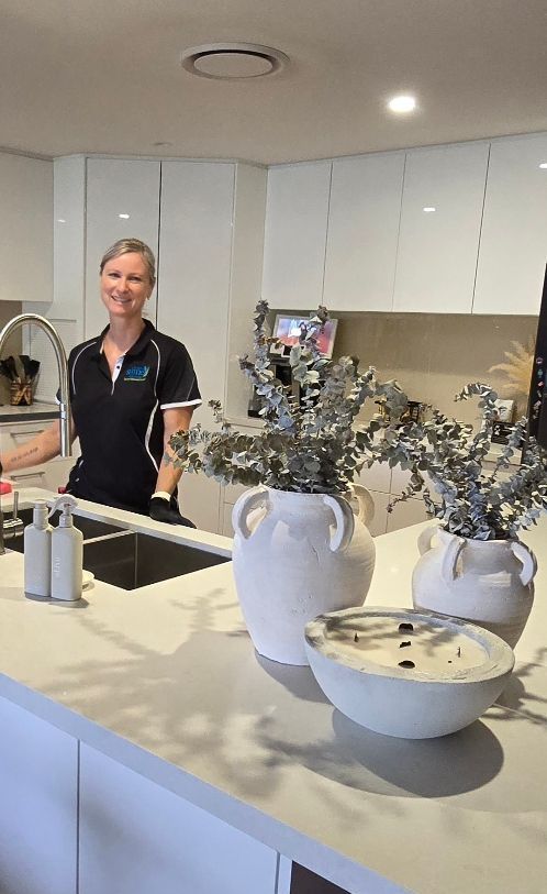 A Bathroom With a Sink, Mirror and Walk in Shower — A Place 2 Shine In Chisholm, NSW