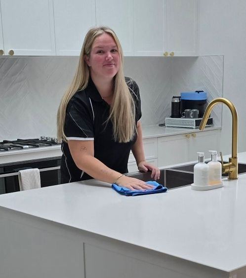 A Person Wearing Purple Gloves is Cleaning Blinds With an Orange Cloth — A Place 2 Shine In Bolwarra, NSW