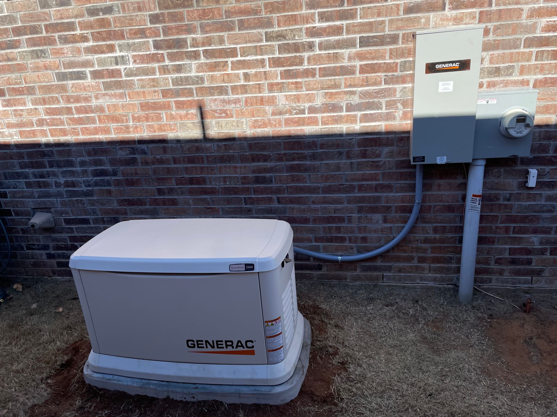 A White Generator Beside A Bricked Wall - Woodward, OK - Moyer Electric