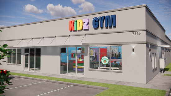 Kidz Gym storefront with colorful sign, awning, windows, and parking area.