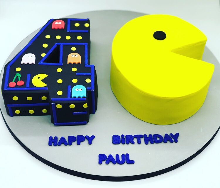 A birthday cake for paul with pac man on it