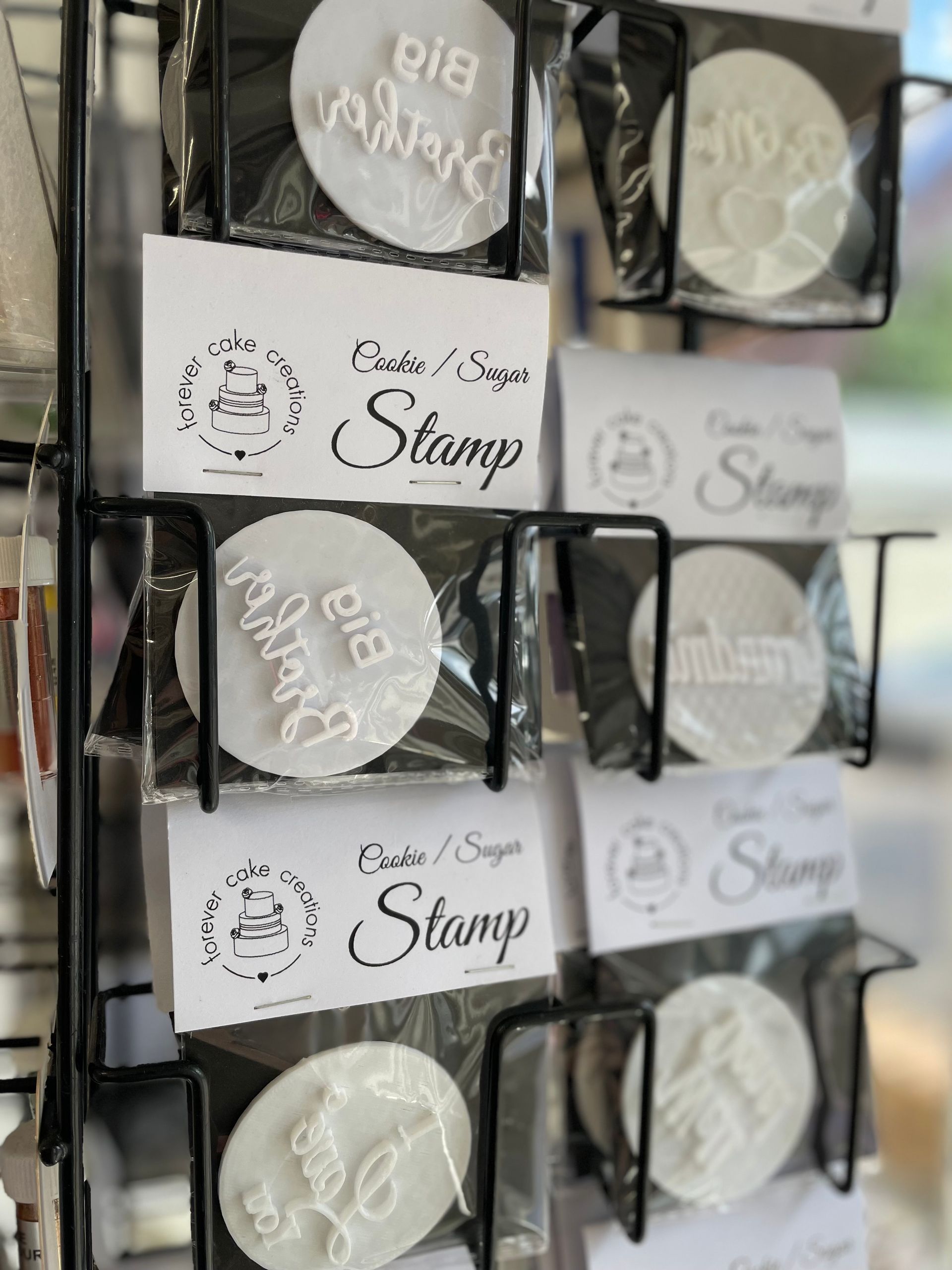 A variety of stamps are displayed on a rack