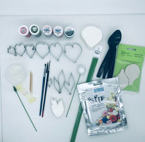 A table topped with a bunch of supplies including a bag of star