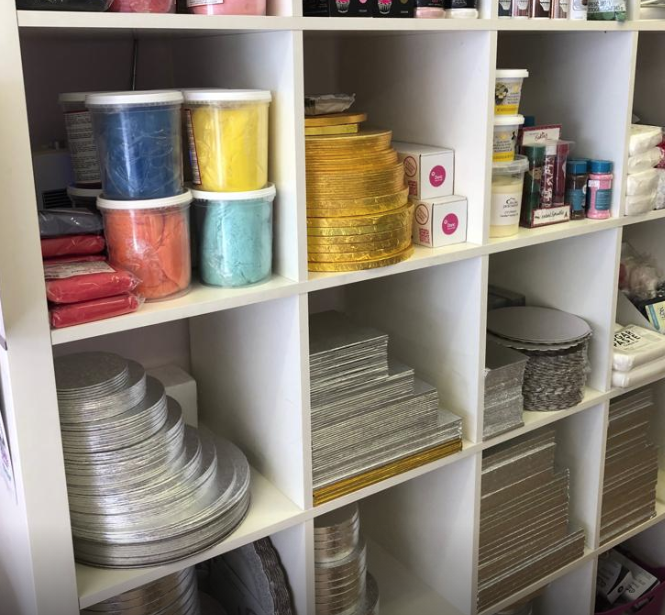 A shelf filled with a variety of baking supplies