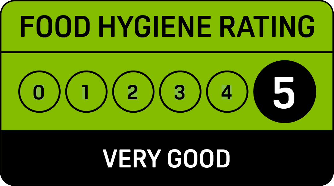 A green sign that says food hygiene rating very good