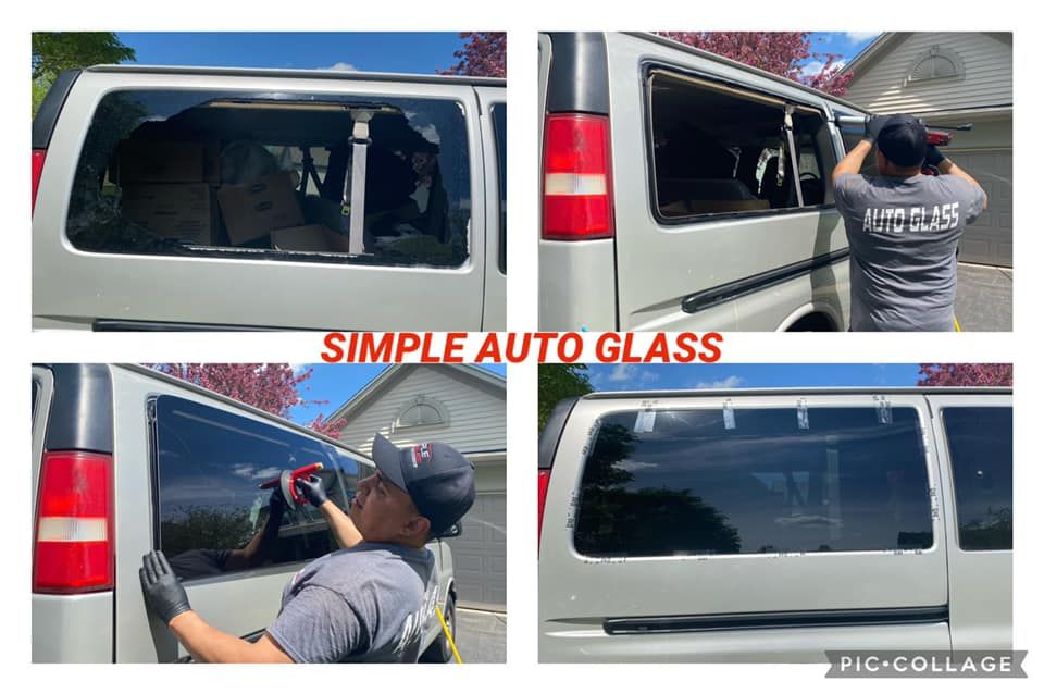 A man is installing a window on a van.