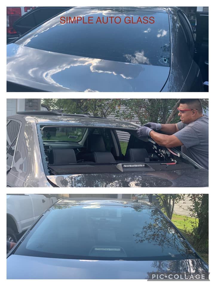 A man is installing a new windshield on a car.