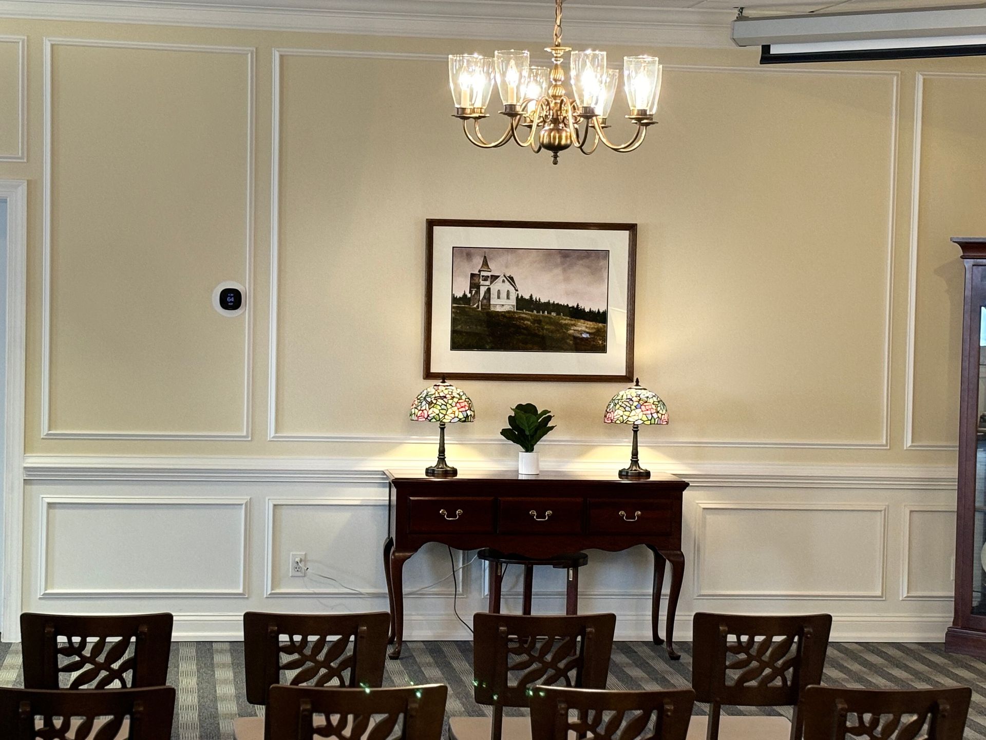 Rows of chairs are lined up in an empty room