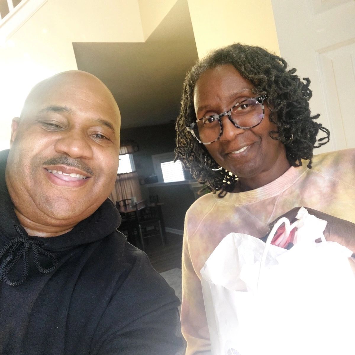 A man and a woman are posing for a picture together