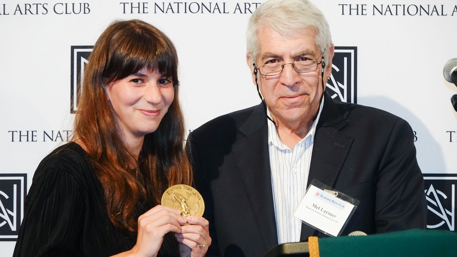 A man and a woman are posing for a picture at the national arts club