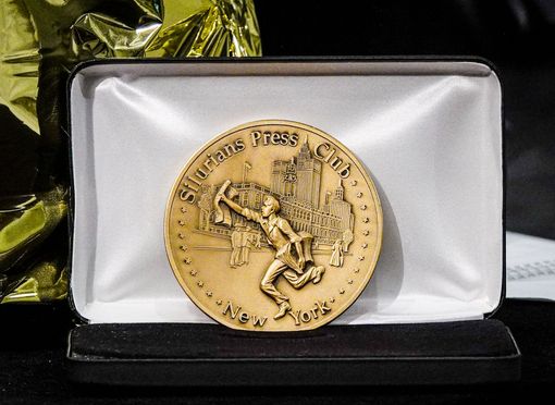 A gold medal engraved