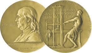 A gold coin with a statue of a man and a woman on it.
