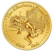 A gold coin with a picture of a man on it