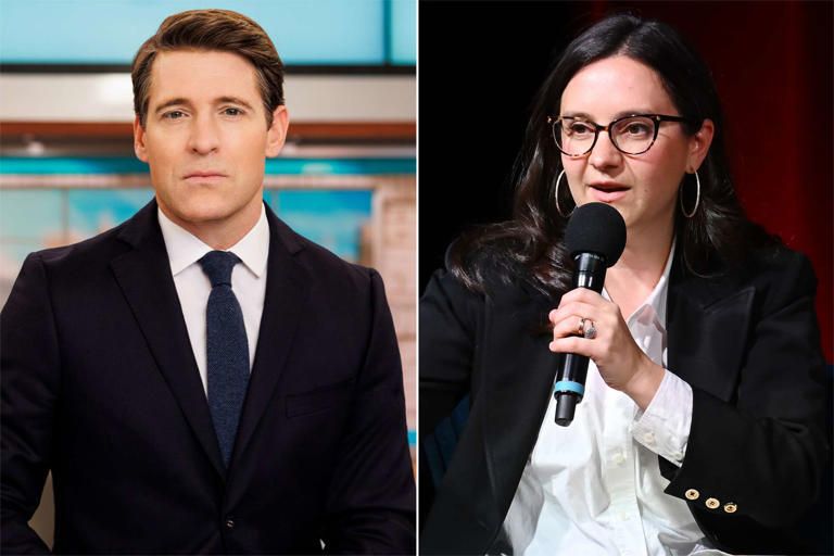 Woman in a blazer and glasses, standing in front of a CBS eye logo.