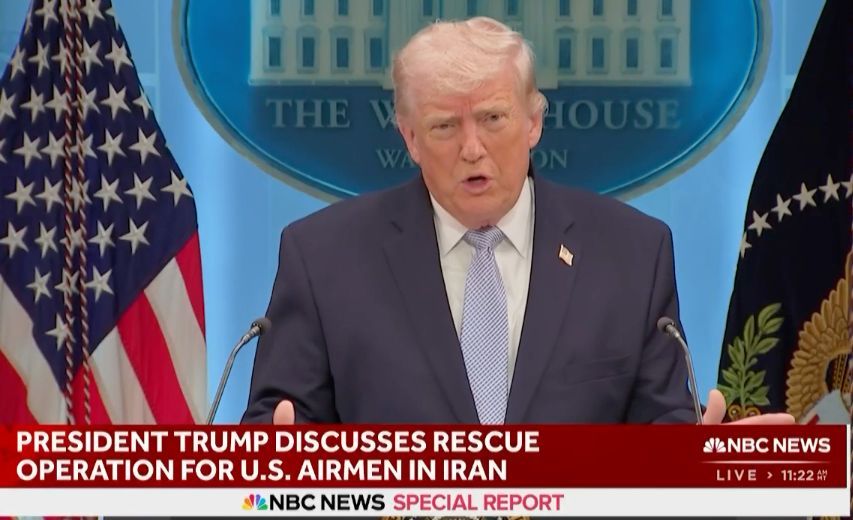 Donald Trump speaks at a White House podium during an NBC News special report on a rescue operation in Iran.