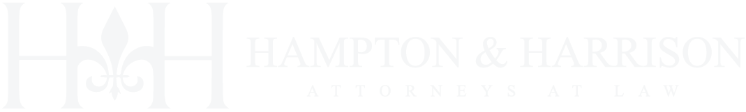 Hampton & Harrison Attorneys at Law logo in white text.