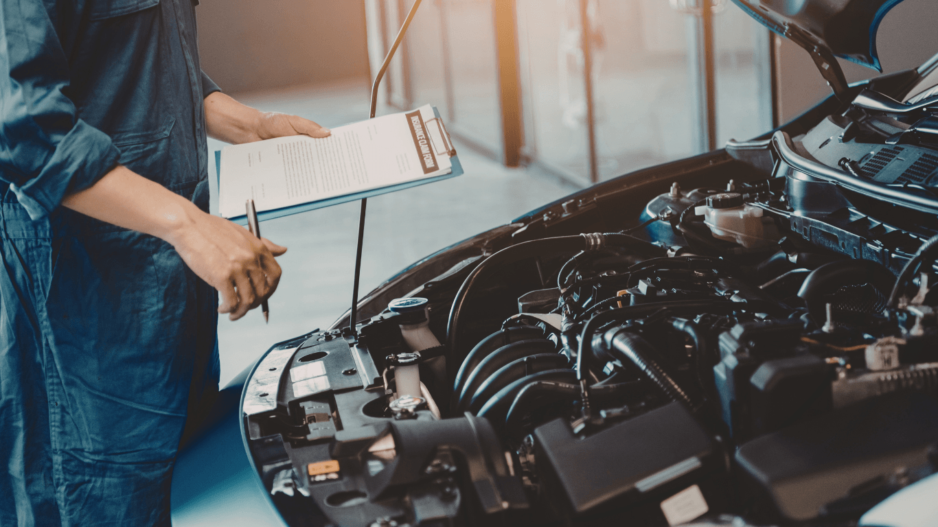 a mechanic replacing a battery in Conroe Tx