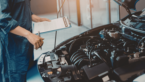 a mechanic replacing a battery in Conroe Tx