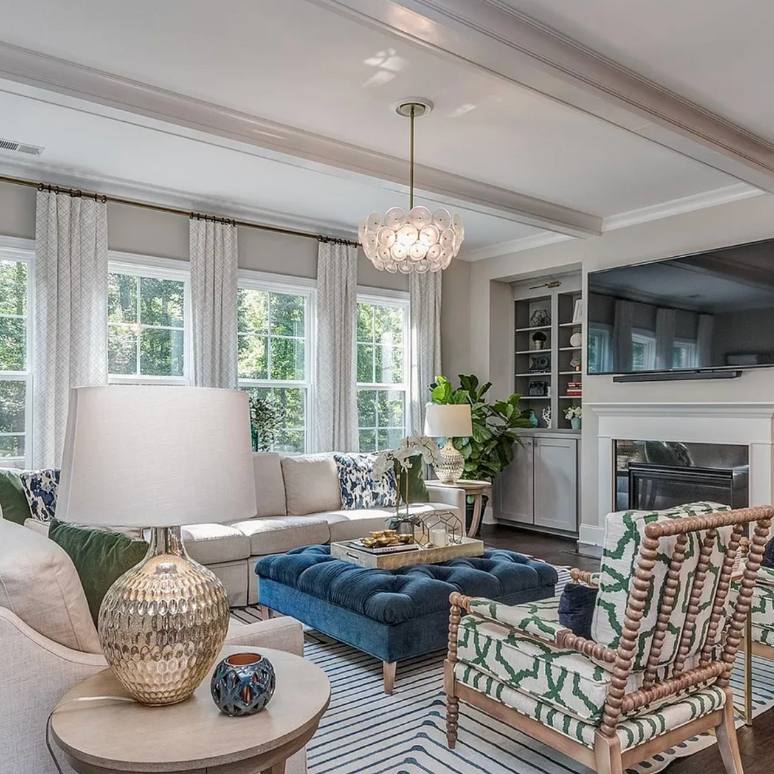 A living room filled with furniture and a fireplace.