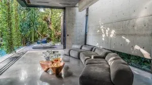 A living room with a large couch and a coffee table.