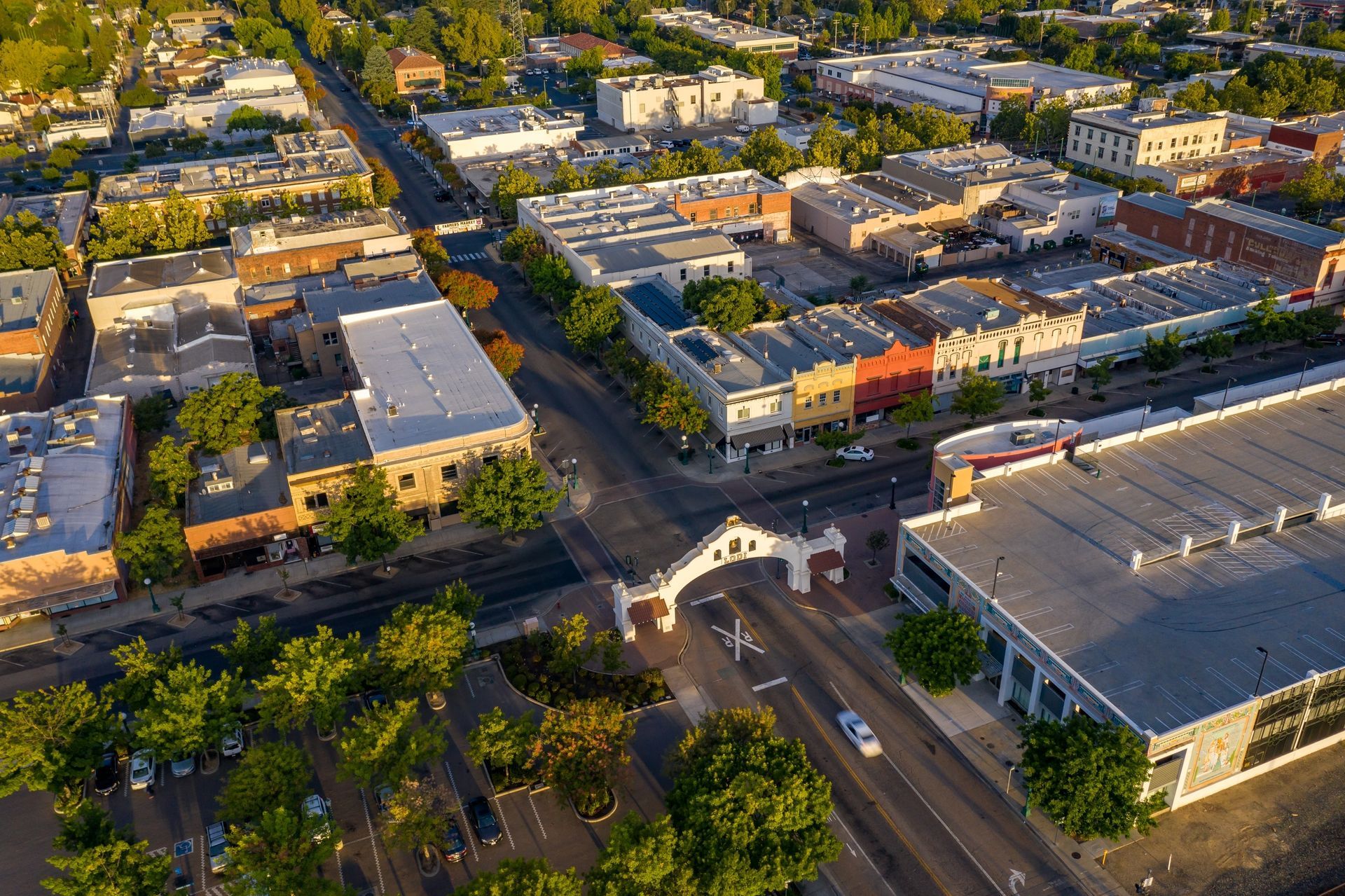 An aerial view of a city with lots of buildings and trees.