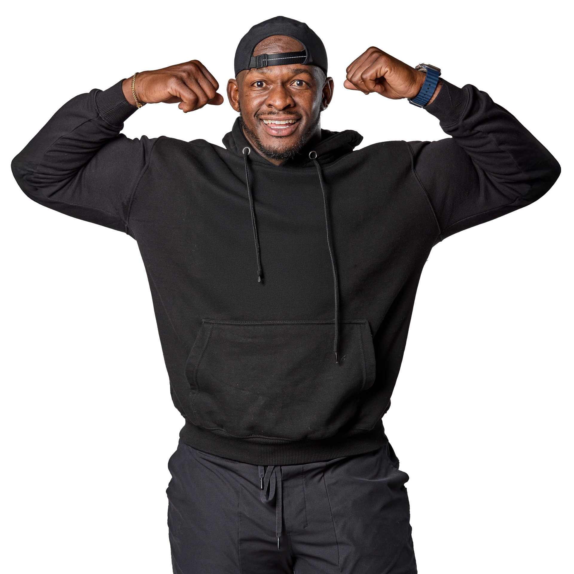A man in a black hoodie is flexing his muscles