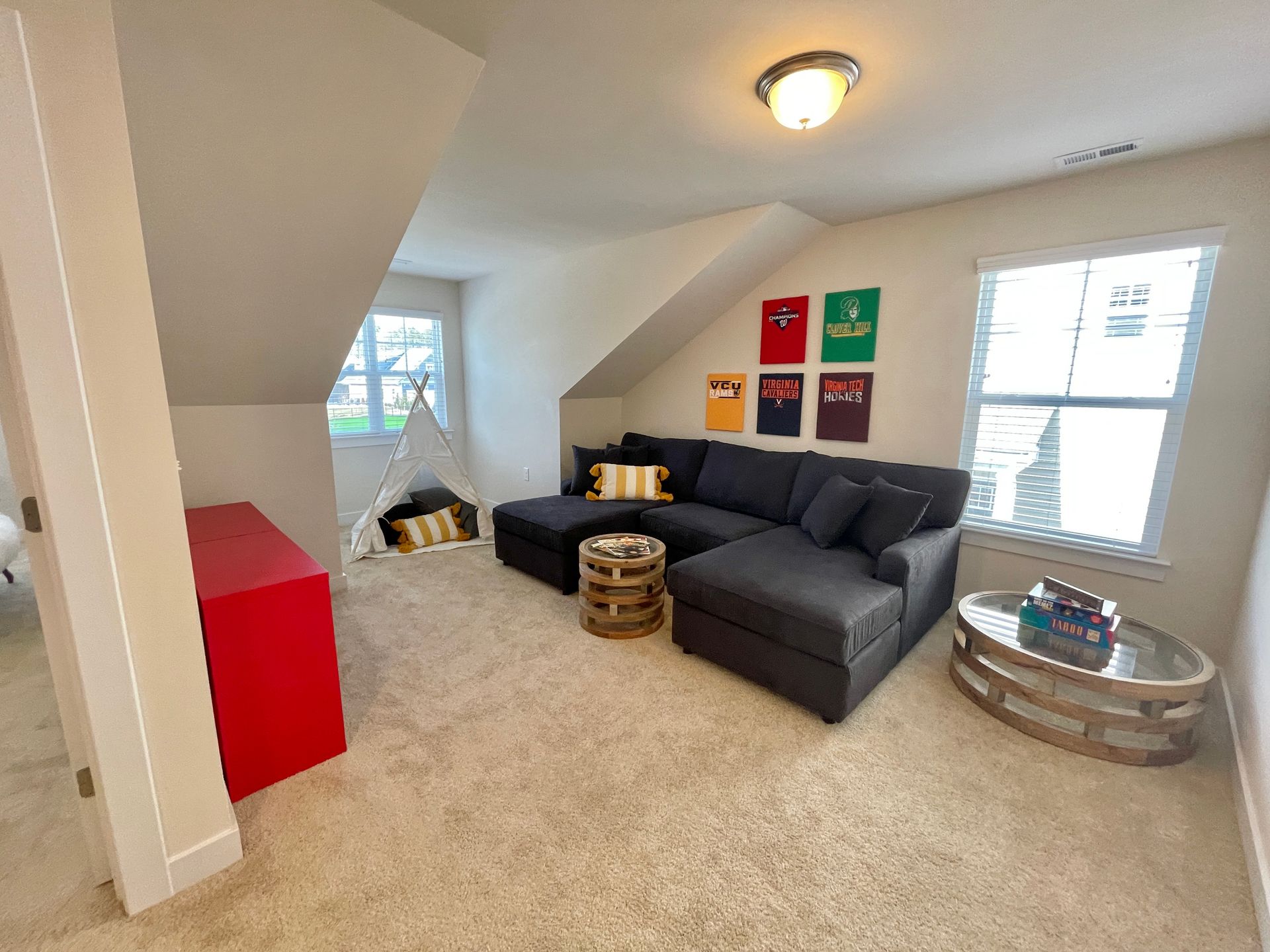 A living room with a sectional couch and a coffee table.