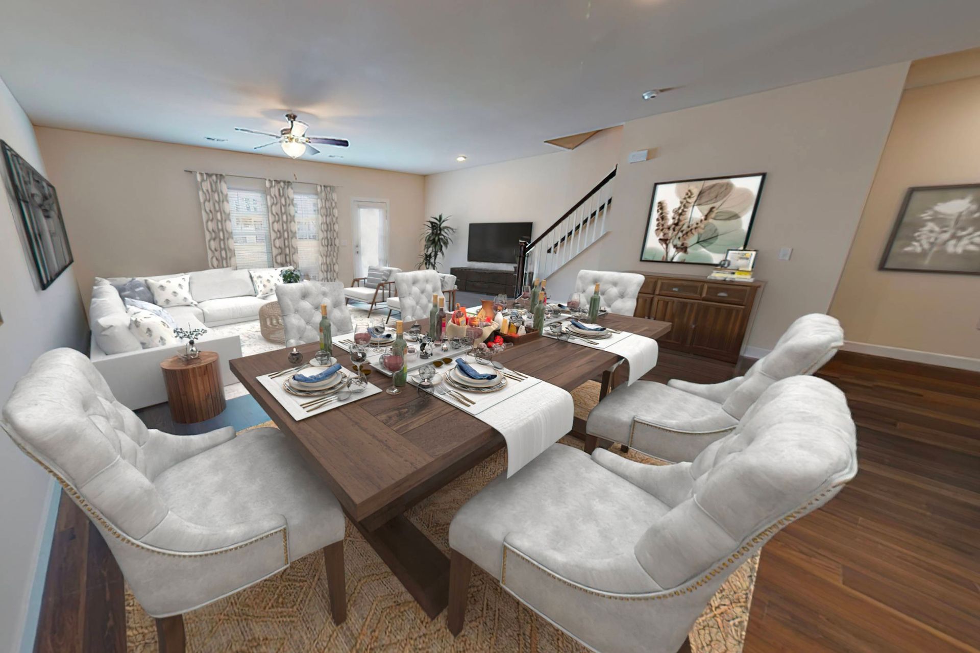 A dining room with a table and chairs and a living room.