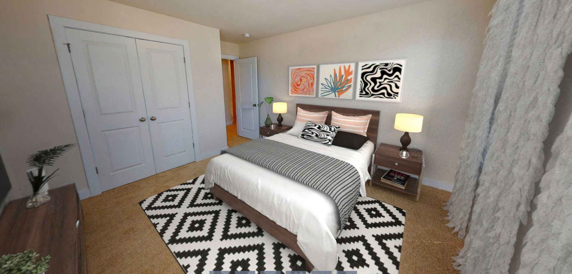 A bedroom with a bed , dresser , nightstand and rug.