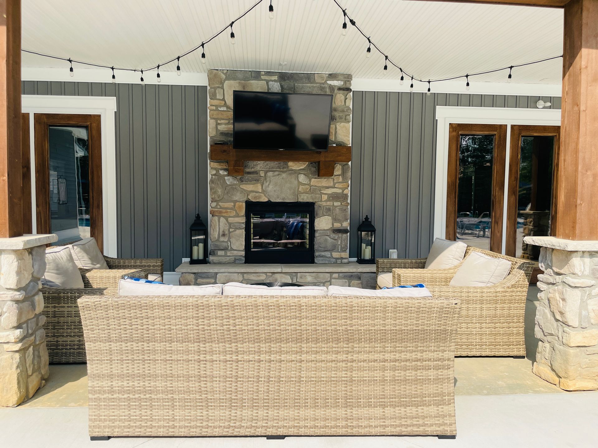 A living room with a fireplace and a flat screen tv.